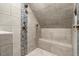 Walk in shower with updated tile, shower head, and built-in bench at 25 Misty Way, Franklinton, NC 27525