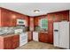 Well-maintained kitchen with tile backsplash, tile floors, stainless appliances and plenty of cabinet space at 25 Misty Way, Franklinton, NC 27525