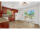 An eat-in kitchen features nice countertops, tile backsplash, stainless appliances and sliding doors to outdoor living at 25 Misty Way, Franklinton, NC 27525