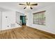 Bright living room featuring hardwood floors, fresh neutral paint, and a staircase leading to the upper level at 25 Misty Way, Franklinton, NC 27525