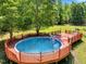 A great above ground pool with a full deck and outdoor furniture makes for relaxing days in the sun at 25 Misty Way, Franklinton, NC 27525