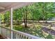 Overlooking view of the yard, captured from the covered porch with classic white railings at 25 Misty Way, Franklinton, NC 27525