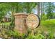 Brookshire community entrance sign surrounded by lush landscaping and mature trees on a sunny day at 30 Elmwood Ave, Sanford, NC 27330