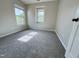 Cozy bedroom features neutral carpeting, and large windows with plenty of natural light at 3021 Remington Oaks Cir, Cary, NC 27519