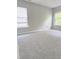 Spacious bedroom features plush carpeting and plenty of natural light from the windows at 3021 Remington Oaks Cir, Cary, NC 27519