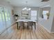 Stylish dining area featuring a modern chandelier and access to outdoor space at 3021 Remington Oaks Cir, Cary, NC 27519