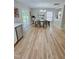 Elegant dining room with modern lighting and sliding glass doors at 3021 Remington Oaks Cir, Cary, NC 27519