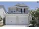 Charming two-story home featuring a two-car garage and well-maintained landscaping at 3021 Remington Oaks Cir, Cary, NC 27519