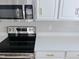 Close up of a kitchen featuring modern appliances and sleek countertops at 3021 Remington Oaks Cir, Cary, NC 27519