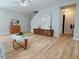 Open-concept living area boasts stylish wood flooring and a neutral color palette at 3021 Remington Oaks Cir, Cary, NC 27519