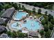 Aerial view of community pool with a variety of water-based activities for the whole Gathering at 3021 Remington Oaks Cir, Cary, NC 27519