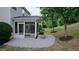 Charming screened-in porch overlooking a yard with mature trees and landscaping at 3021 Remington Oaks Cir, Cary, NC 27519