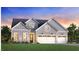 Charming two-story home with three-car garage, grey siding, and multiple gables at 305 Mugby Rd # 162, Raleigh, NC 27610