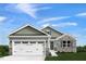 Charming single-Gathering home with a two-car garage, stone accents, and manicured lawn at 31 Elmwood Ave, Sanford, NC 27330