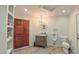 Well-lit half bathroom with elegant marble countertops and traditional fixtures at 3197 Carriage Creek Ct, Haw River, NC 27258
