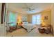 This bright bedroom features natural light with a rocking chair, side tables, and a comfortable chair at 3197 Carriage Creek Ct, Haw River, NC 27258