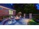 Cozy backyard fire pit area with comfortable seating, perfect for relaxing evenings outdoors at 3197 Carriage Creek Ct, Haw River, NC 27258