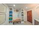 Convenient mud room with custom built-in storage lockers and bench at 3197 Carriage Creek Ct, Haw River, NC 27258