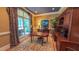 Traditional home office with a large arched window, hardwood floors, and custom built-in cabinetry at 3197 Carriage Creek Ct, Haw River, NC 27258