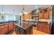 Well-appointed kitchen with granite countertops, stainless steel appliances, and a center island with a sink at 3197 Carriage Creek Ct, Haw River, NC 27258