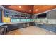 Modern kitchen with sleek gray cabinetry, stainless steel appliances, and beverage cooler at 3197 Carriage Creek Ct, Haw River, NC 27258