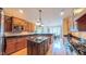 Gourmet kitchen featuring granite countertops, stainless steel appliances, and custom cabinetry at 3197 Carriage Creek Ct, Haw River, NC 27258