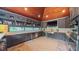 Modern kitchen with sleek gray cabinetry, stainless steel appliances, and beverage cooler at 3197 Carriage Creek Ct, Haw River, NC 27258