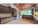 Gourmet kitchen with stainless steel appliances and a breakfast bar leading to the outdoor patio at 3197 Carriage Creek Ct, Haw River, NC 27258