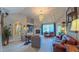 Bright living room featuring a vaulted ceiling, a fireplace, and multiple seating areas at 3197 Carriage Creek Ct, Haw River, NC 27258