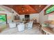 Spacious living room featuring vaulted wood ceilings, stone fireplace, and neutral decor at 3197 Carriage Creek Ct, Haw River, NC 27258