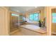 Beautiful main bathroom with a soaking tub, glass shower and decorative window for a spa-like feel at 3197 Carriage Creek Ct, Haw River, NC 27258