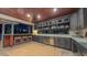 Beautiful outdoor bar area with bar seating, wine cooler and folding glass doors at 3197 Carriage Creek Ct, Haw River, NC 27258