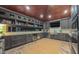 Outdoor kitchen featuring stainless steel appliances, custom cabinets and a wine cooler at 3197 Carriage Creek Ct, Haw River, NC 27258