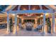 Elegant outdoor living space with vaulted wood ceilings, comfortable seating, and a view of the interior at 3197 Carriage Creek Ct, Haw River, NC 27258