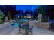 Beautiful pool area with a spa and patio furniture, showcasing the perfect outdoor entertainment space at 3197 Carriage Creek Ct, Haw River, NC 27258