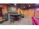 Recreation area featuring a brick bar area, drums, and garage door access at 3197 Carriage Creek Ct, Haw River, NC 27258
