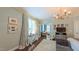 This sitting room off the main bedroom provides a relaxing retreat with comfortable seating and ample natural light at 3197 Carriage Creek Ct, Haw River, NC 27258