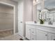 Bright bathroom showcasing a double sink vanity, modern fixtures, and a walk-in shower at 32 Elmwood Ave, Sanford, NC 27330
