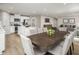 Well-lit dining area connected to kitchen and living spaces with a dark wooden table at 32 Elmwood Ave, Sanford, NC 27330