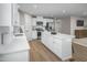 Spacious kitchen featuring a large island, stainless steel appliances, and light-colored cabinetry at 32 Elmwood Ave, Sanford, NC 27330