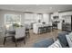 Open concept living space with a modern kitchen, dining area, and comfortable seating at 32 Elmwood Ave, Sanford, NC 27330