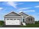 Charming single-Gathering home with stone accents and a two-car garage under a clear sky at 33 Elmwood Ave, Sanford, NC 27330