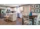 Spacious kitchen with an island and dining area, featuring modern stainless steel appliances at 33 Elmwood Ave, Sanford, NC 27330