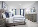 Bright main bedroom with natural light, complemented by elegant furnishings and soothing color scheme at 34 Elmwood Ave, Sanford, NC 27330