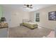 Bedroom featuring carpeted floors, a ceiling fan and a window at 3841 Rawls Church Rd, Fuquay Varina, NC 27526