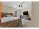 Bedroom with a ceiling fan, a window, and a bed and dresser set, with carpeted floors at 3841 Rawls Church Rd, Fuquay Varina, NC 27526
