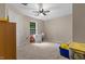 Bedroom with carpeted floors, a ceiling fan and a window at 3841 Rawls Church Rd, Fuquay Varina, NC 27526