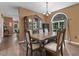 Elegant dining room with classic furnishings and a large window that offers natural lighting at 3841 Rawls Church Rd, Fuquay Varina, NC 27526