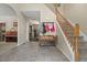 Inviting foyer with tiled floors, staircase, and view into other rooms providing great flow for guests at 3841 Rawls Church Rd, Fuquay Varina, NC 27526
