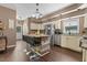 Spacious kitchen features a center island with seating, stainless steel appliances, and ample cabinet space at 3841 Rawls Church Rd, Fuquay Varina, NC 27526